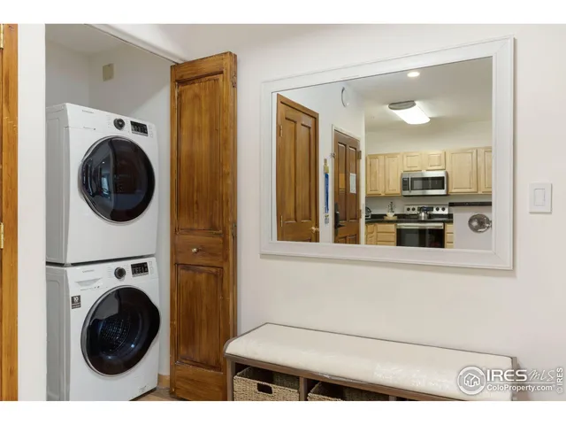 a view of a kitchen with washer and dryer