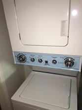 2104 Enfield Road, Unit D Austin, TX 78703 - Photo 11 of 14 Laundry area with stacked washer and clothes dryer