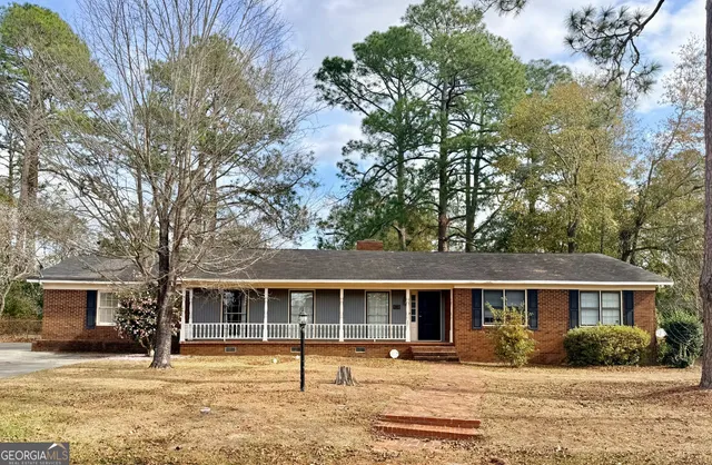 a front view of a house with a patio