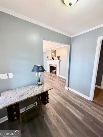 a view of hallway with wooden floor