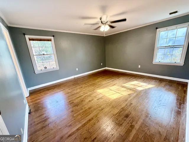 a bathroom with a sink toilet and mirror