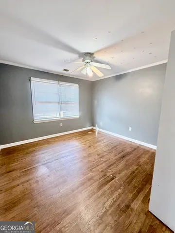 a view of empty room with large windows