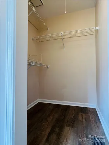 a view of an empty walk in closet