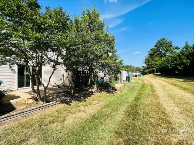 a view of a park with iron fence