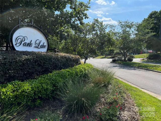 a view of a lake with houses in the back