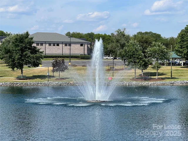 a view of swimming pool with lounge chair