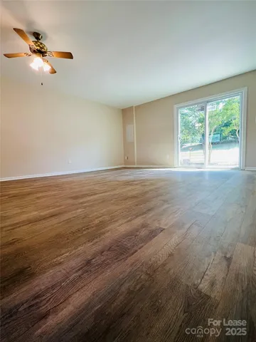 a view of an empty room with windows