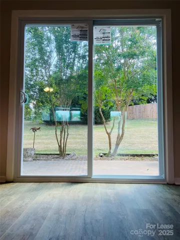 a view of a living room and a floor to ceiling window