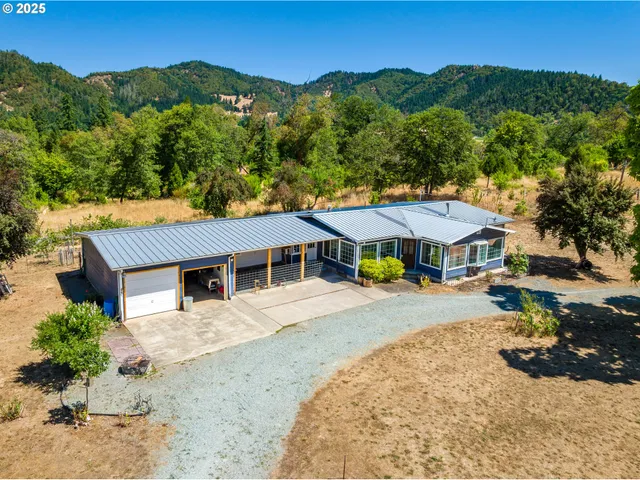 an aerial view of lake residential houses with outdoor space and swimming pool