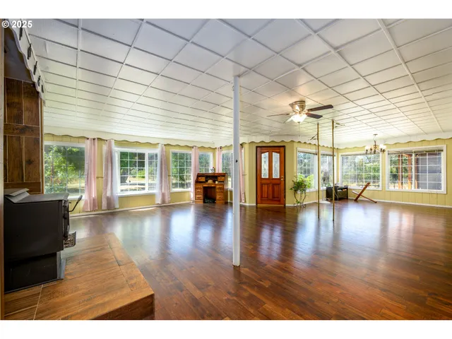 a view of livingroom with furniture wooden floor and windows