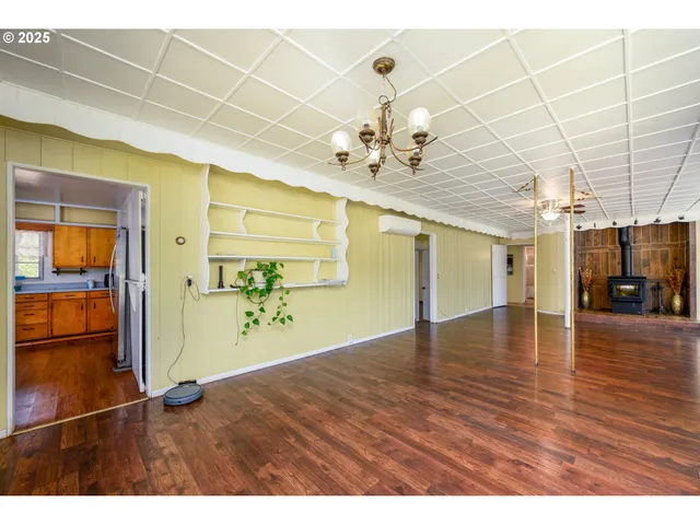a kitchen with stainless steel appliances sink refrigerator and window