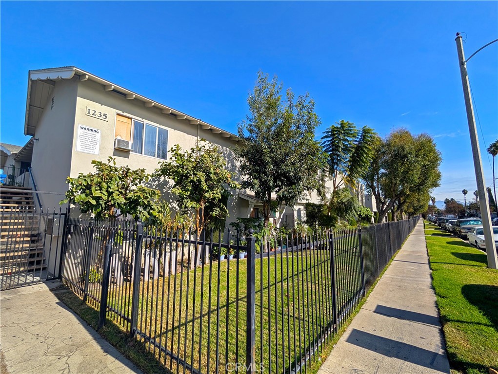 1239 West Brook Street Santa Ana, CA 92703 - Photo 1 of 4 a view of a house with a balcony