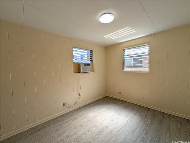 an empty room with a empty space and a window