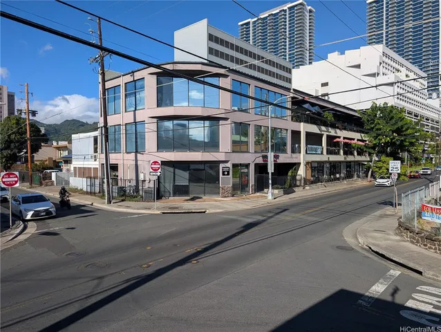 a front view of a building with street view