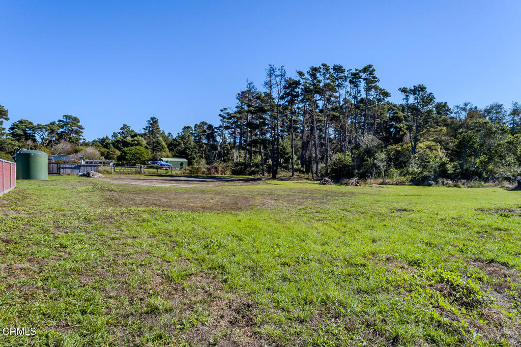 18451 Highway 1 Fort Bragg, CA 95437 - Photo 6 of 8 a front view of a house with a yard