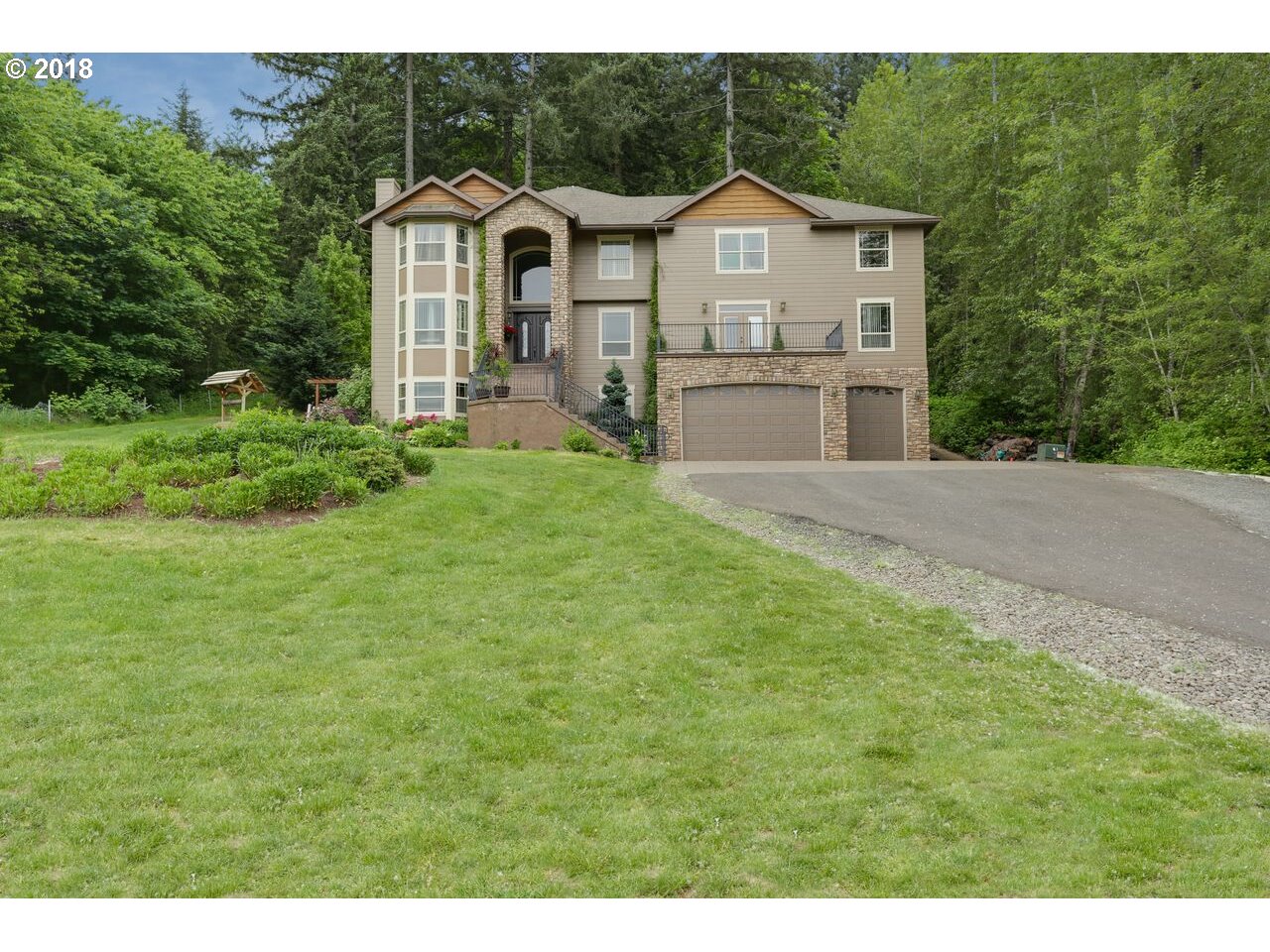 17980 Southeast Vogel Road Damascus, OR 97089 - Photo 1 of 32 a front view of a house with yard