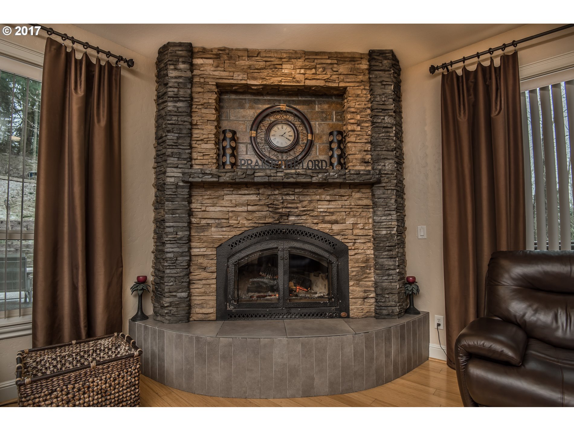 17980 Southeast Vogel Road Damascus, OR 97089 - Photo 13 of 32 a living room with furniture and a fireplace