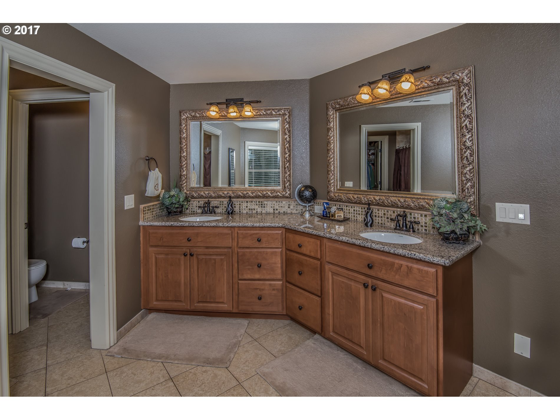17980 Southeast Vogel Road Damascus, OR 97089 - Photo 19 of 32 a bathroom with a sink and a mirror
