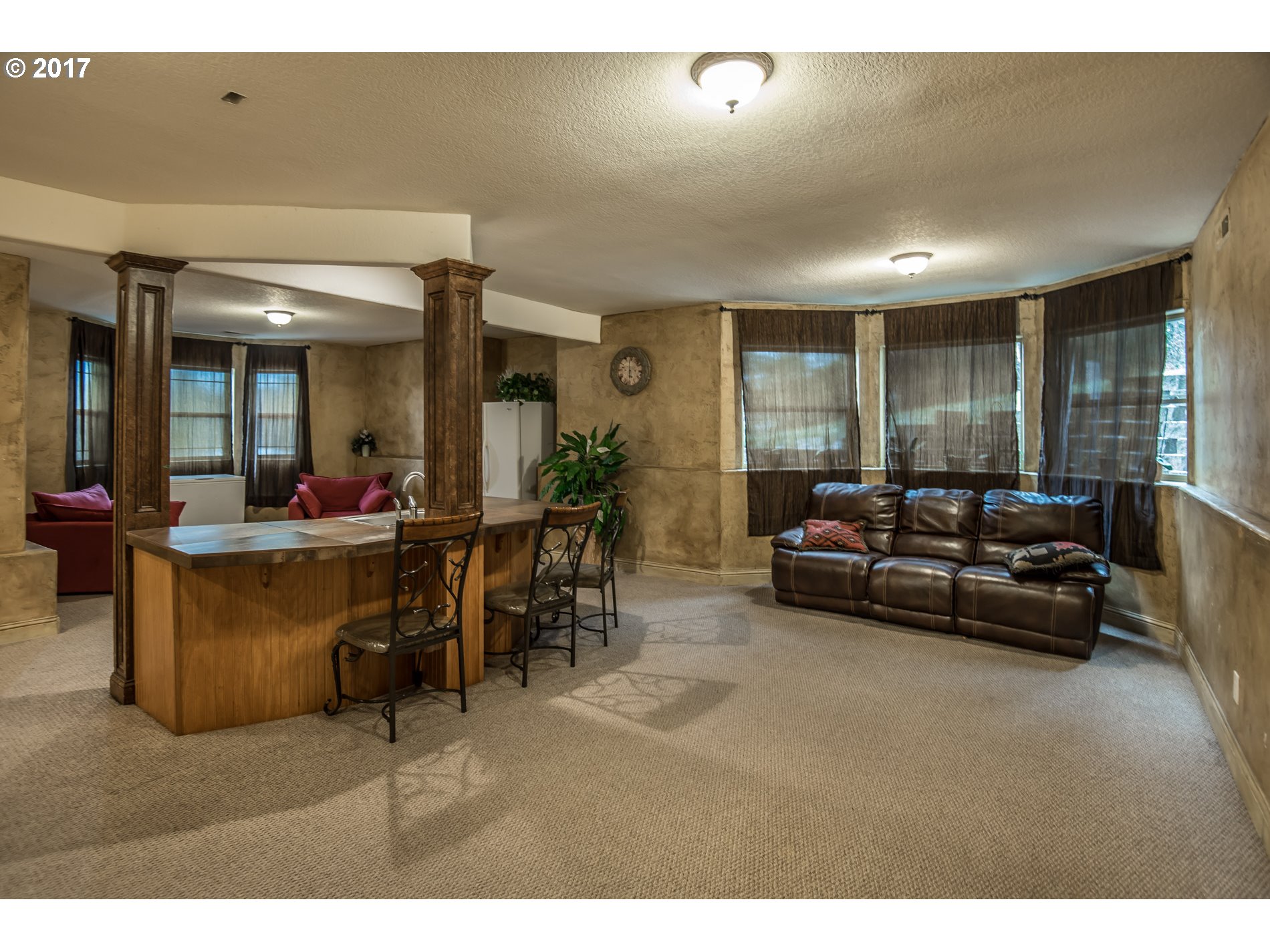 17980 Southeast Vogel Road Damascus, OR 97089 - Photo 27 of 32 a living room with furniture and a large window