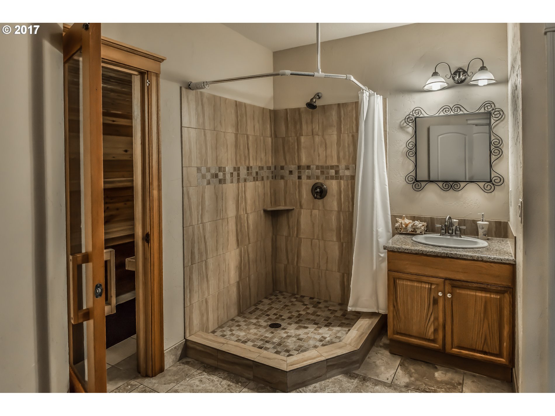 17980 Southeast Vogel Road Damascus, OR 97089 - Photo 28 of 32 a bathroom with a sink and a mirror