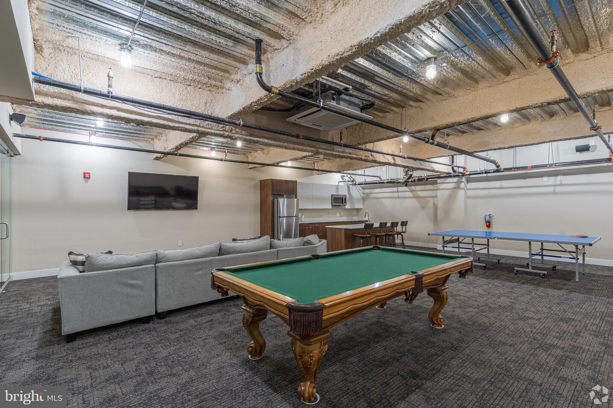 4534 Spruce Street, Unit 1BD3 Philadelphia, PA 19139 - Photo 8 of 9 a room with furniture and windows