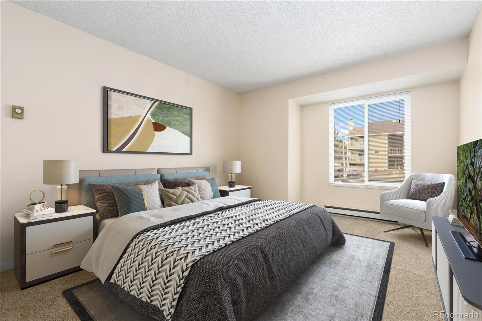 4068 South Atchison Way, Unit 202 Aurora, CO 80014 - Photo 17 of 33 a bedroom with a bed and wooden floor