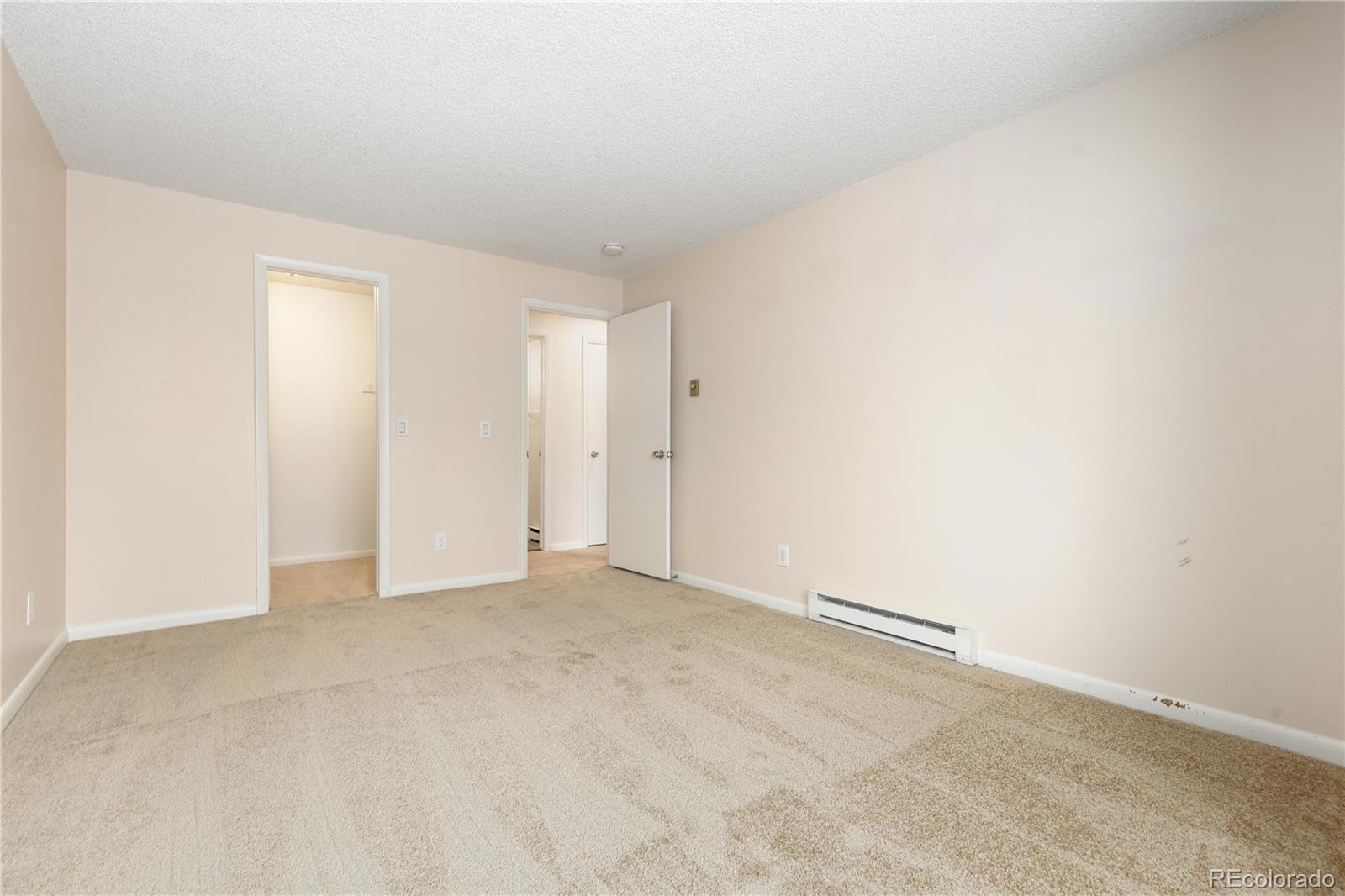 4068 South Atchison Way, Unit 202 Aurora, CO 80014 - Photo 18 of 33 an empty room with an entryway