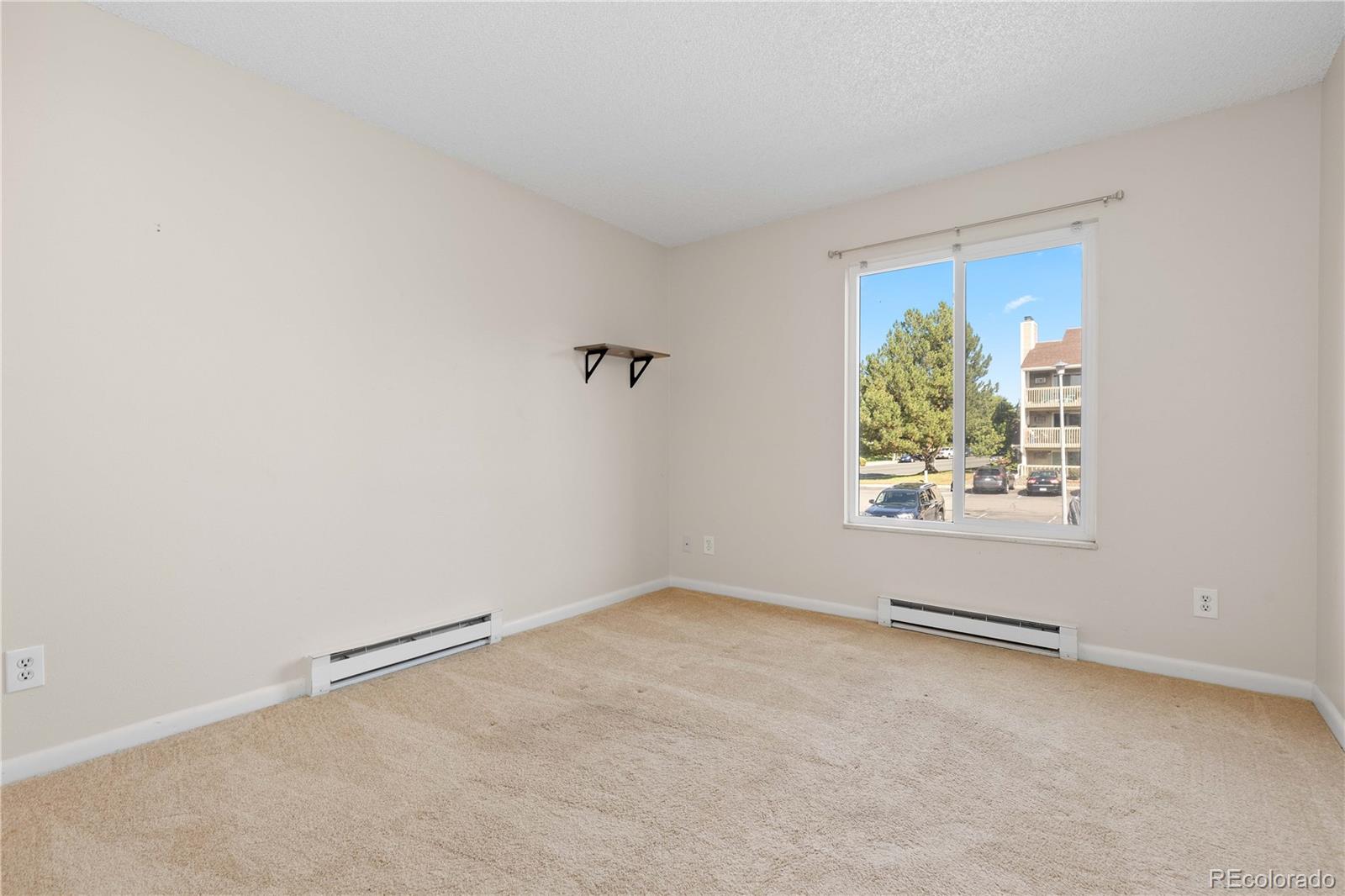 4068 South Atchison Way, Unit 202 Aurora, CO 80014 - Photo 22 of 33 an empty room with windows