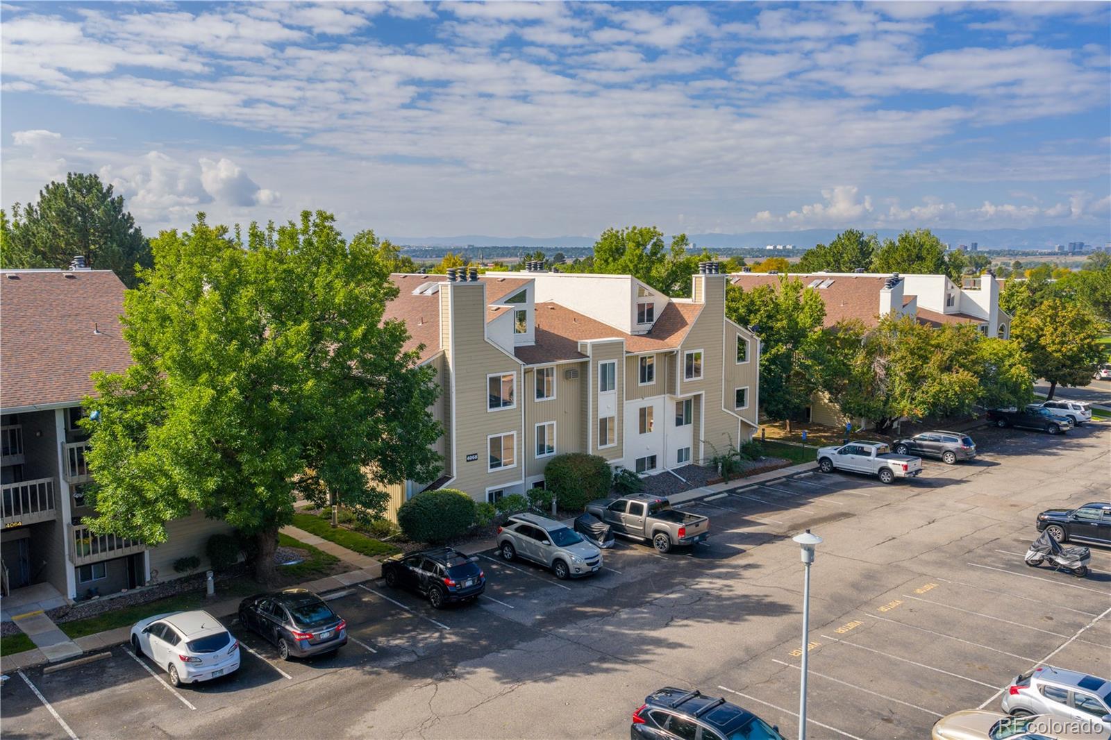 4068 South Atchison Way, Unit 202 Aurora, CO 80014 - Photo 28 of 33 a view of a patio with table and chairs and potted plants