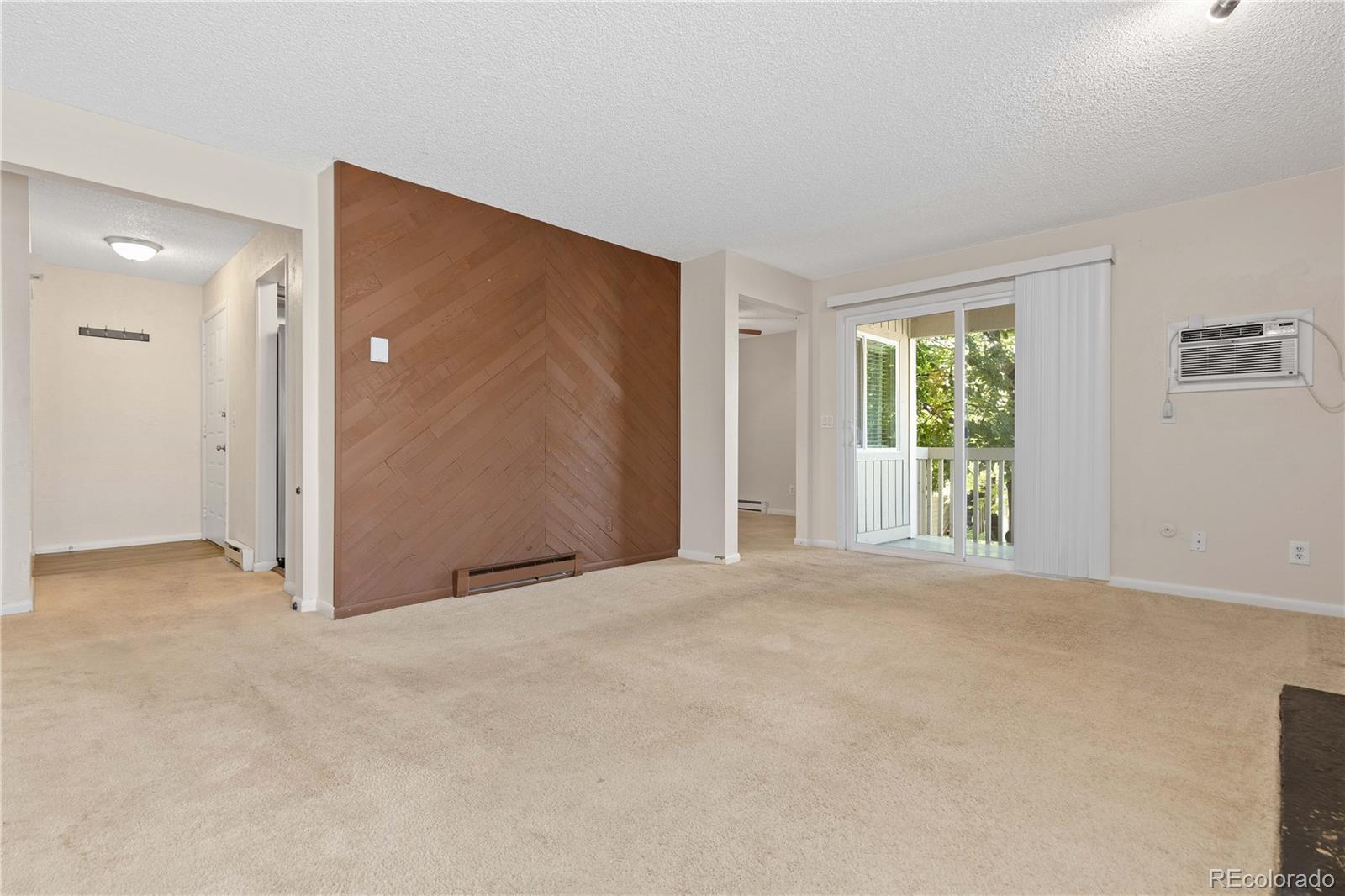 4068 South Atchison Way, Unit 202 Aurora, CO 80014 - Photo 6 of 33 a view of an empty room with a window