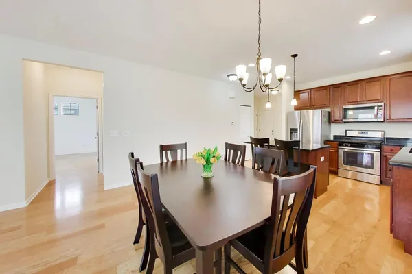 a view of a dining room with furniture and wooden floor