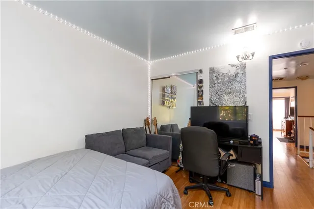 a bedroom with a bed and a chair