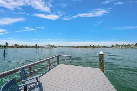 a view of a lake and outdoor seating