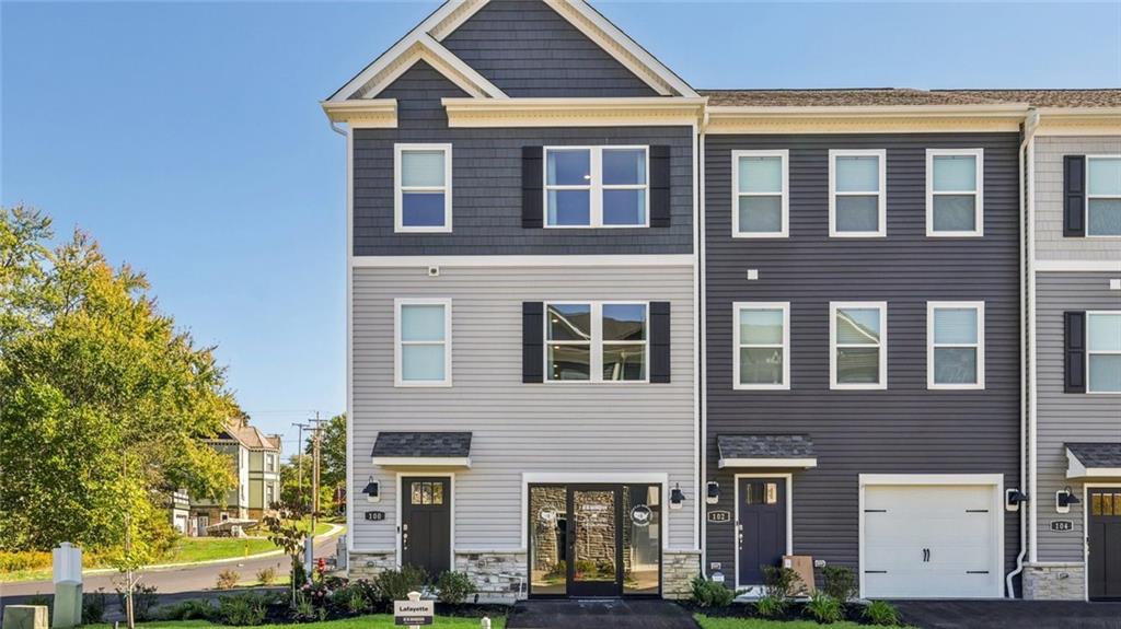 a front view of a building with many windows