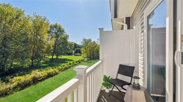 a view of a patio with furniture and garden