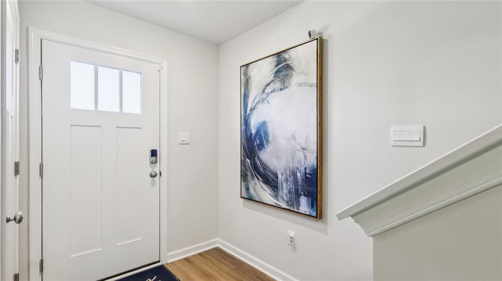 263 Truth Circle Harmony, PA 16037 - Photo 2 of 19 a view of a hallway with a painting on the wall