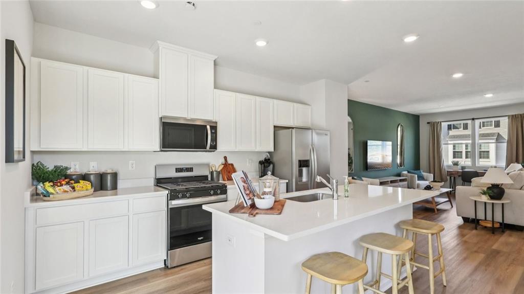263 Truth Circle Harmony, PA 16037 - Photo 6 of 19 a kitchen with a sink white cabinets and stainless steel appliances