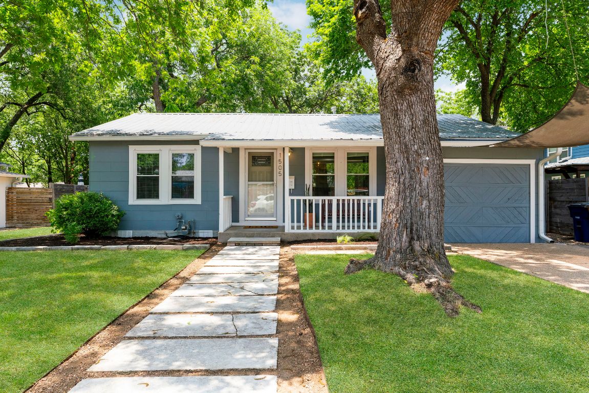 1505 Palo Duro Road Austin, TX 78757 - Photo 1 of 1 front view of a house with a yard