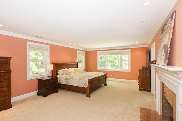 82 Middle Street Lexington, MA 02421 - Photo 13 of 27 a spacious bedroom with a bed and a flat tv screen next to a window