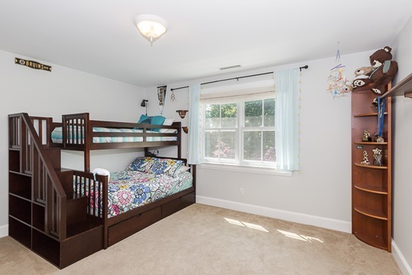 82 Middle Street Lexington, MA 02421 - Photo 17 of 27 a bedroom with a bed and a window