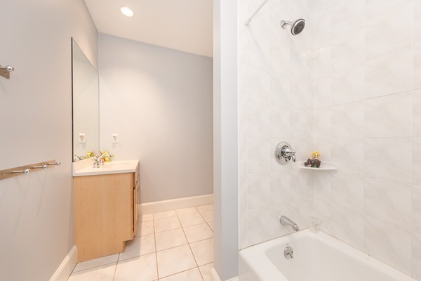 82 Middle Street Lexington, MA 02421 - Photo 21 of 27 a bathroom with a tub sink and mirror