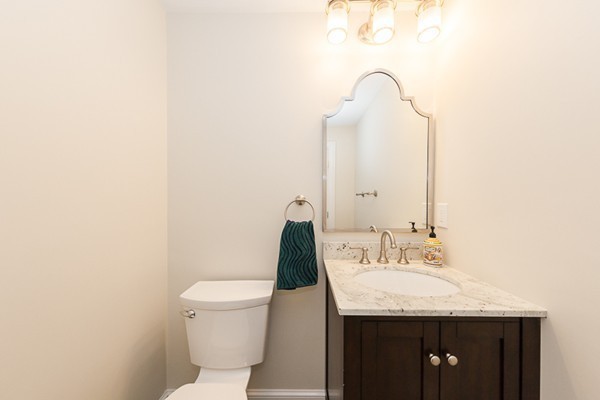 82 Middle Street Lexington, MA 02421 - Photo 25 of 27 a bathroom with a granite countertop sink and a toilet