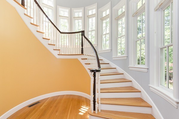 82 Middle Street Lexington, MA 02421 - Photo 3 of 27 a view of staircase with lots of frames on wall and windows
