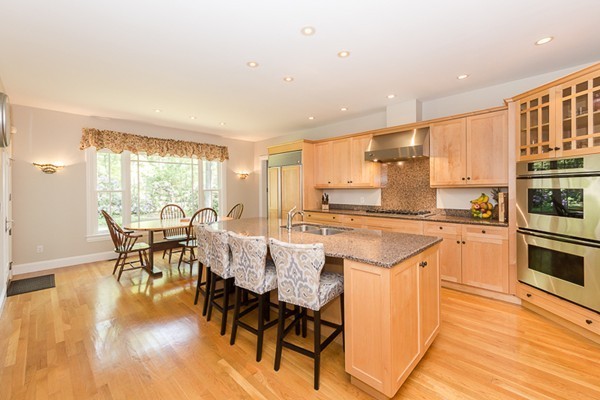 82 Middle Street Lexington, MA 02421 - Photo 5 of 27 a large kitchen with a table and chairs