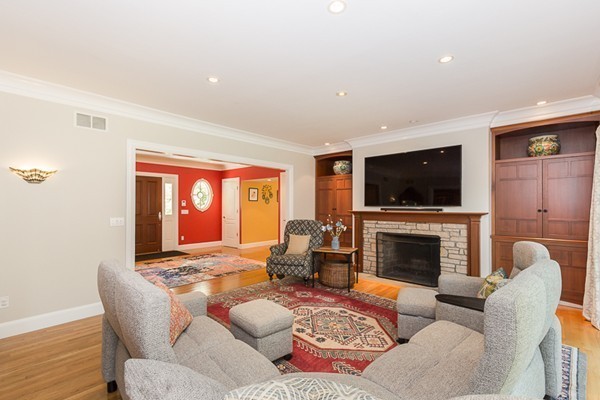82 Middle Street Lexington, MA 02421 - Photo 7 of 27 a living room with furniture flat screen tv and a fireplace