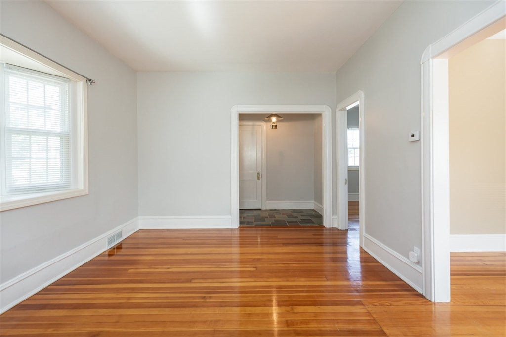 2714 Riverside Avenue Somerset, MA 02726 - Photo 11 of 36 a view of an empty room with wooden floor and a window