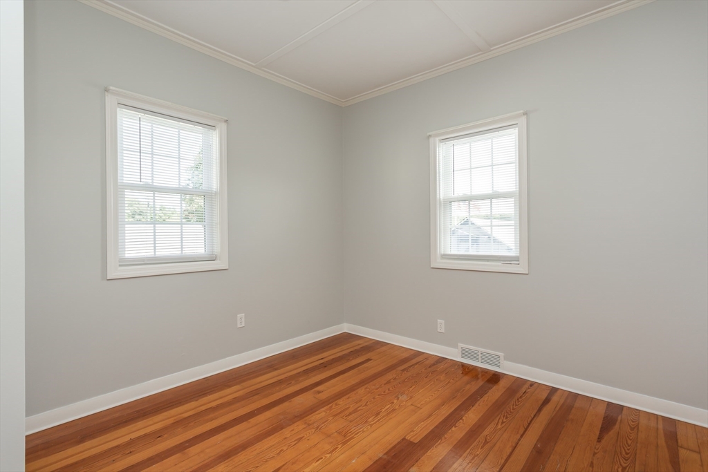 2714 Riverside Avenue Somerset, MA 02726 - Photo 17 of 36 an empty room with wooden floor and windows