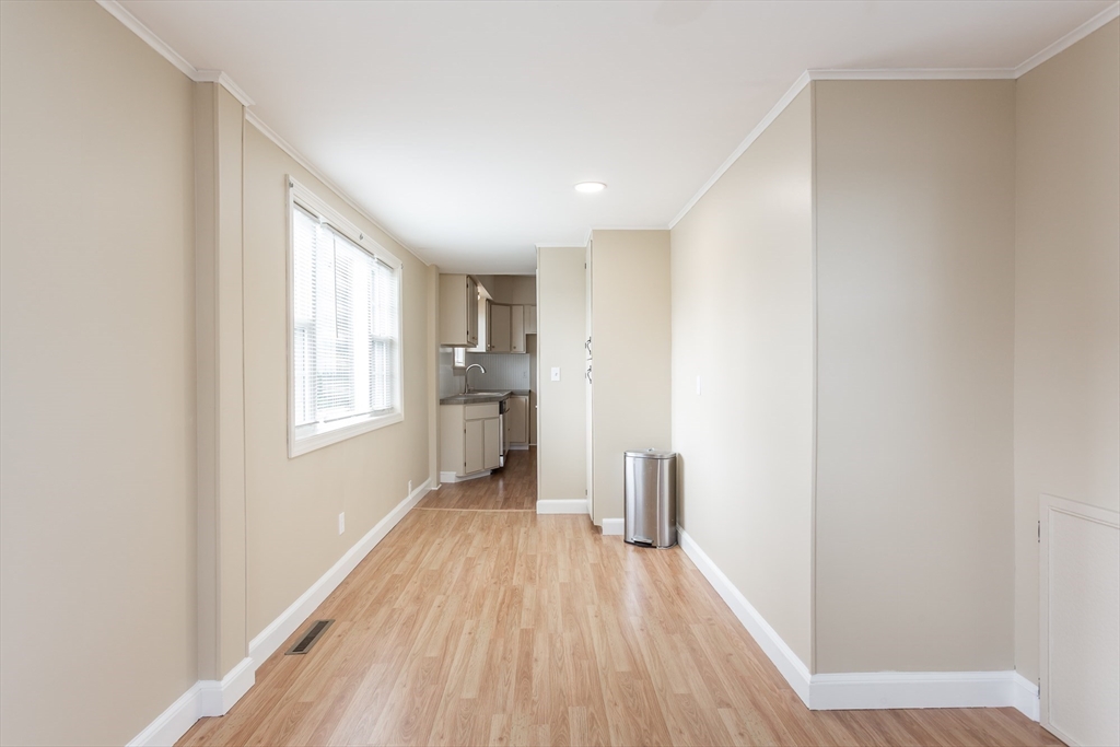 2714 Riverside Avenue Somerset, MA 02726 - Photo 25 of 36 a view of a hallway with wooden floor