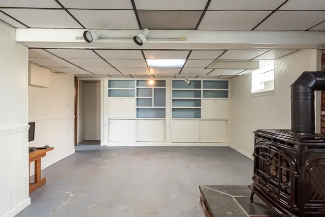 a view of an empty room with a fireplace