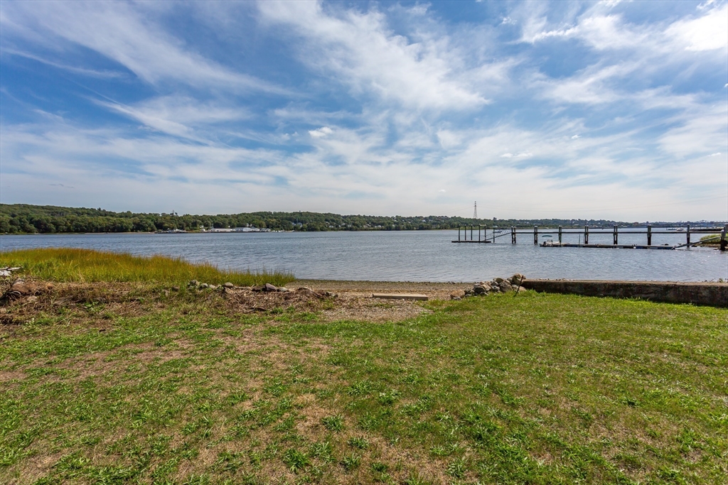 2714 Riverside Avenue Somerset, MA 02726 - Photo 7 of 36 a view of a lake with houses in the back